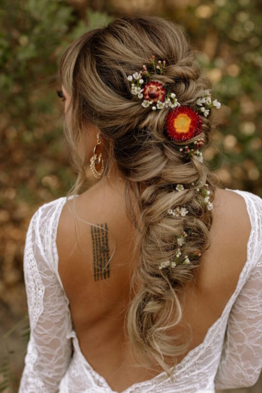 30 stunning ways to wear wedding hair flowers delicate budded fishtale min 683x1024 1 534x800 1