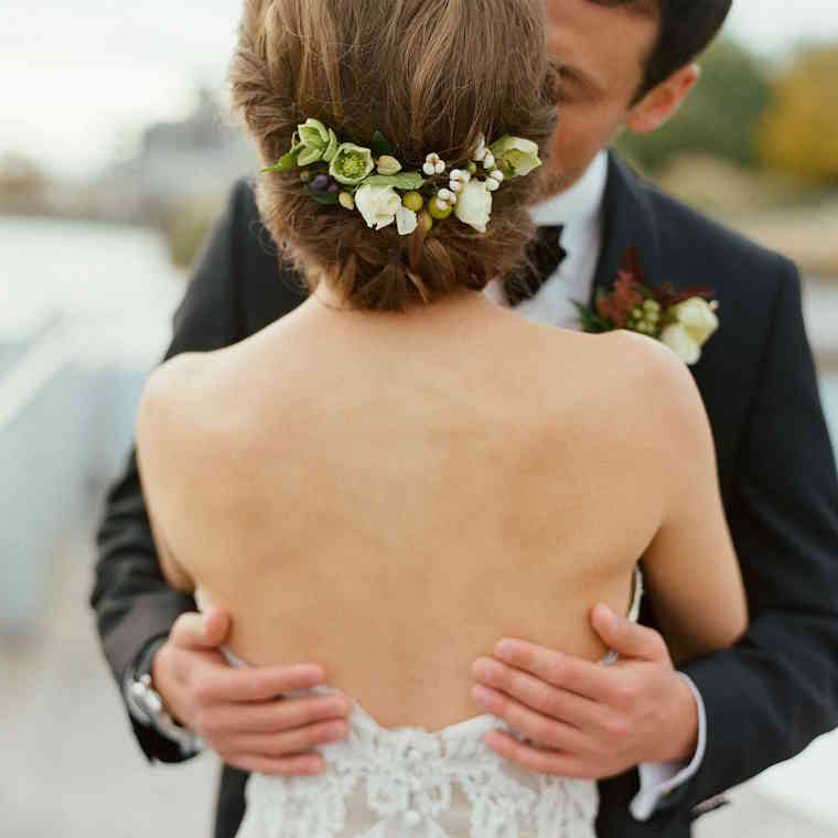 30 stunning ways to wear wedding hair flowers soft chignon with buds min