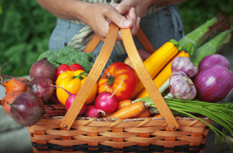 A basket filled with organic fruit and vegetables