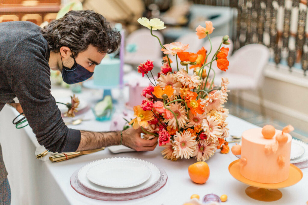 Colourful flower arrangements orange poppies and peach daisies