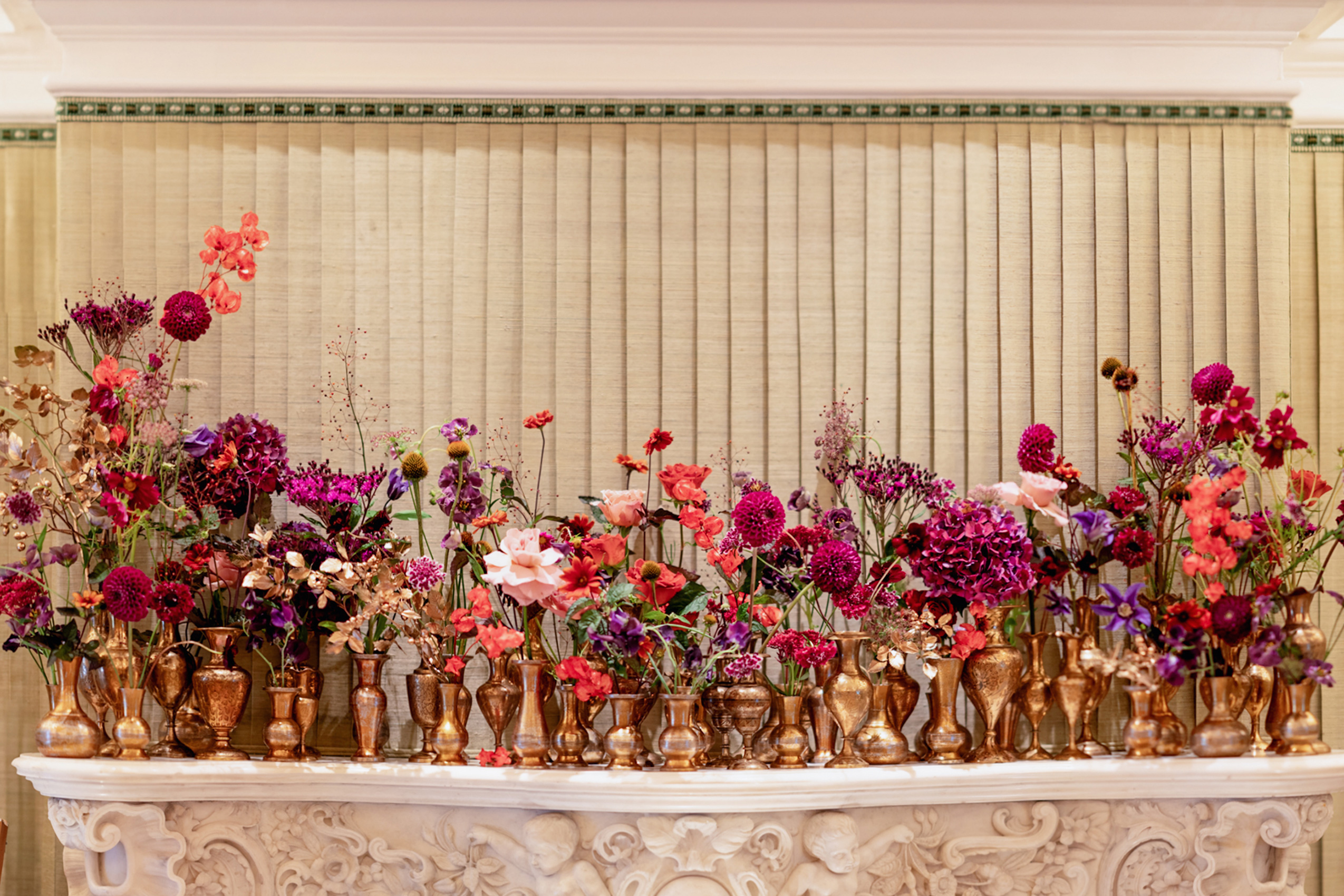 Event flowers - flower arrangements for events, a modern asymmetrical installation in deeb burgundy and red colour scheme