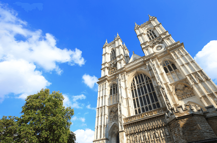 Westminster abbey with blue skies and white clouds as a backdrop