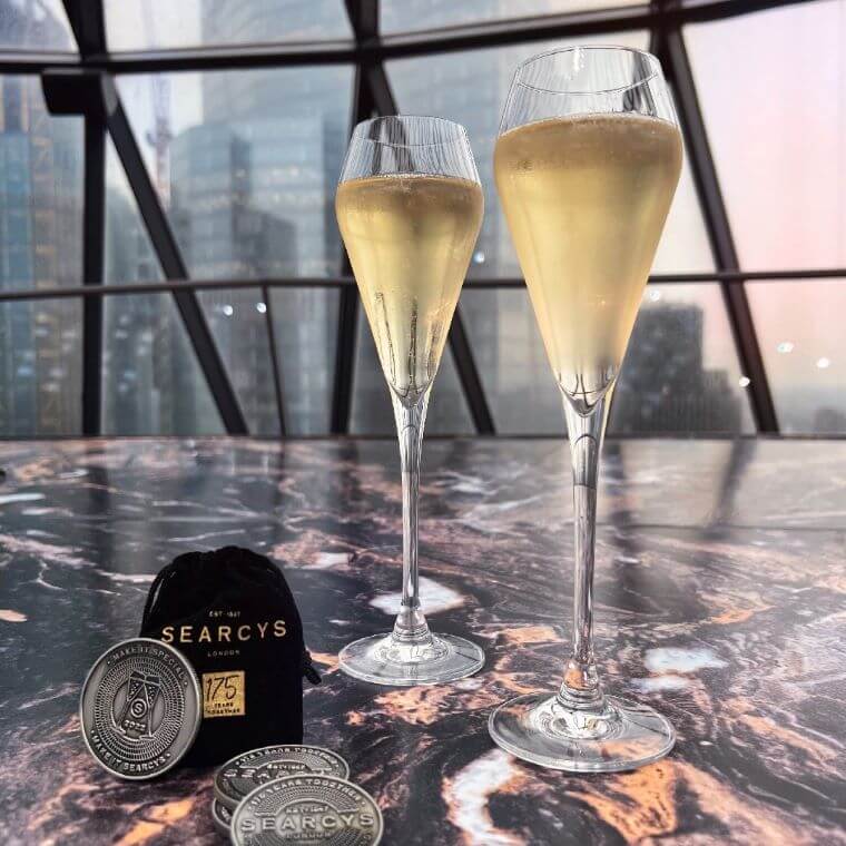 Two glasses of champagne on a table at searcys