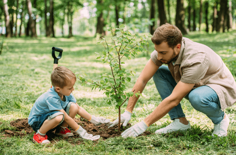 A father and son planting a tree