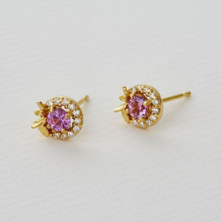 A pair of pink madagascan sapphire and diamond stud earrings