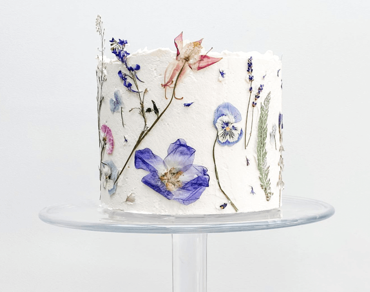 Pressed edible flowers on a wedding cake