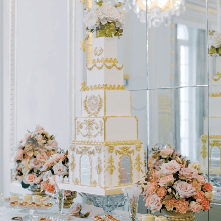 Rose and gold wedding cake and flowers