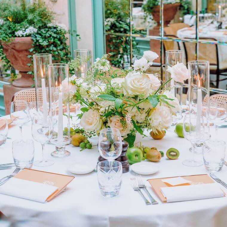 A round table set for a wedding at daphne's