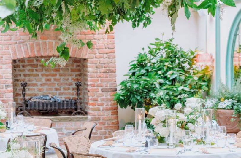 Tables set with floral centrepieces at daphne's in london
